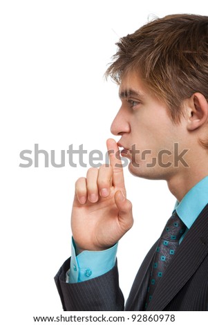 man with finger on lips