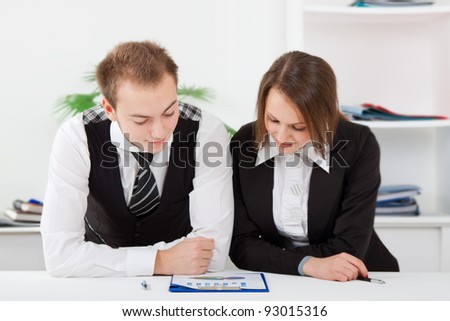 young business people working on project in team together, men and women discussing the problem, business plan, papers charts, document, businesspeople sitting at desk office