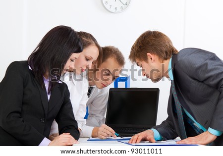 young business people working  on project in team together, men and women discussing the problem, business plan, papers charts, document,  businesspeople meeting sitting at desk office