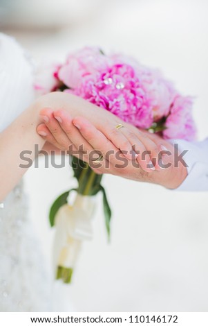 Beautiful wedding bouquet and hands