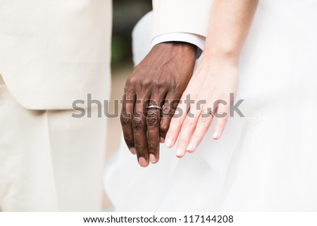 Married couple holding hands