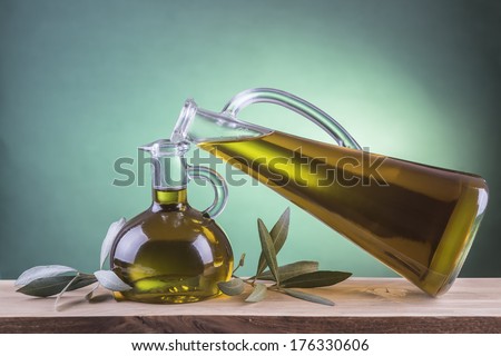 Olive oil bottles on a green spotlight background