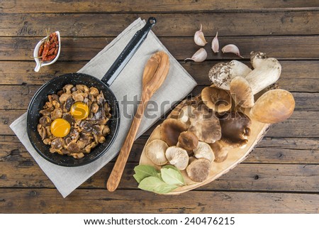Cooking scrambled eggs with mushrooms and natural ingredients and spices