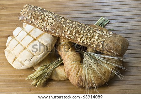 Some bread and cereals on a bamboo mat.