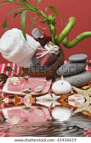 Spa background with hygiene and decorative items in red.