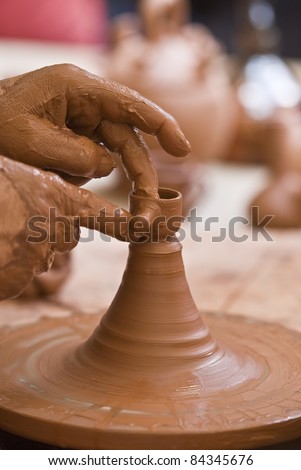 Potter working with clay.