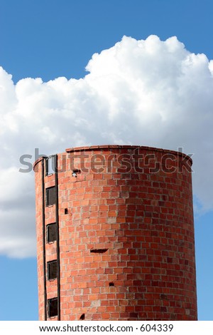 Old farm silo against a western sky.