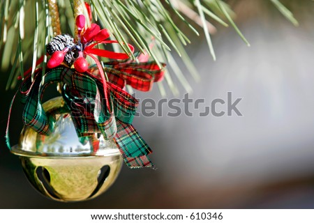 Christmas Sleigh Bell Ornament on a Pine tree