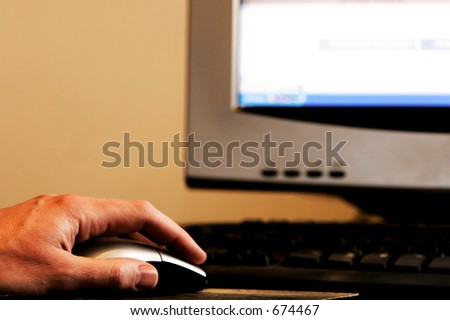 Man\'s hand using a computer mouse - work, school, surfing the internet, etc.