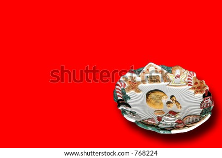 A plate for Santa\'s cookies, and he left only one half-eaten cookie left, and some crumbs (red background).