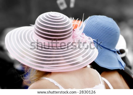 Girls in Pretty Hats Watch an Event Together (shallow focus, soft focus effect, color to black & white effect).