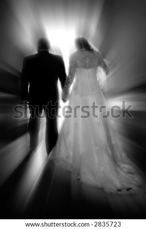 A bride & groom walk toward a new life together #1 (black & white, zoom special effect).
