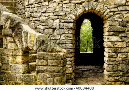 Close up of old Stone Castle with winding stairs, arched room and window.