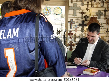 PARKER, CO - APRIL 3: Denver Broncos kicker turned author, Jason Elam, autographs books for fans at Crosswalk Christian Bookstore on April 3, 2010 in Parker, CO.  Elam has co-authored three novels.