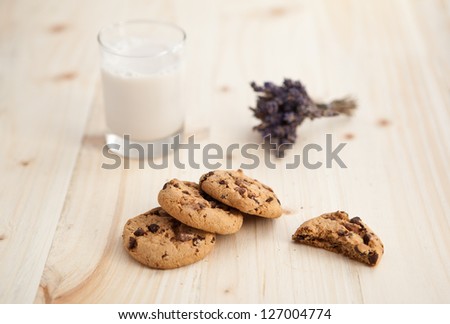 Chocolate chips cookies on a wooden table with lavender bunch