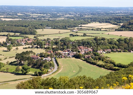 View of the South Downs way from the hill, East Sussex, England: fields and the houses