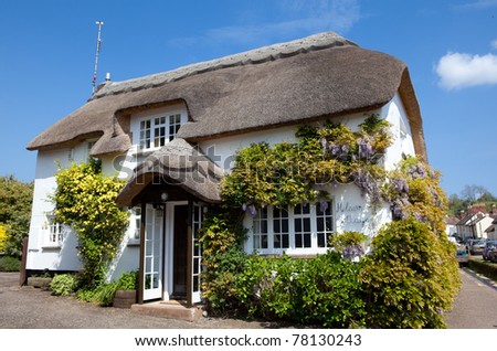 Pretty thatched cottage in the village of Otterton, Devon, UK