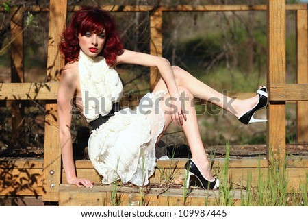 Pretty Woman Outdoors Wearing a Lace Dress
