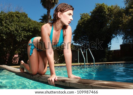 Beautiful Woman With a Swimming Pool During Summer
