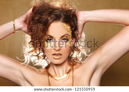 Stunning Female Model Adorned with Gold Leaf Cosmetics