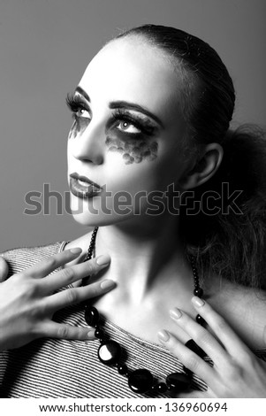 High Fashion Model With Extreme Make Up in Studio