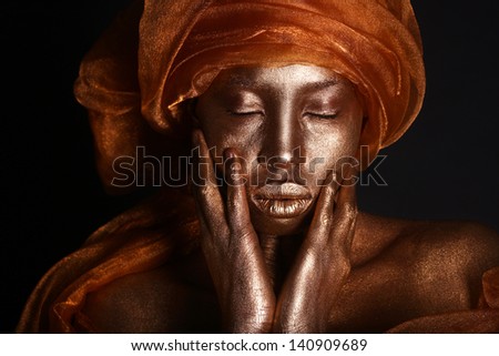 African American Woman Painted With Gold