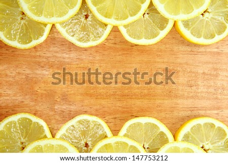Lemon Fruit Slices Sitting on a Wooden Surface