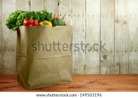 Bagged Grocery Produce Items on a Wooden Plank