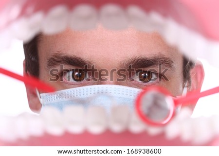 Dentist Working Inside a Patient Mouth