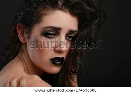 Sad Thinking Woman on Black Background