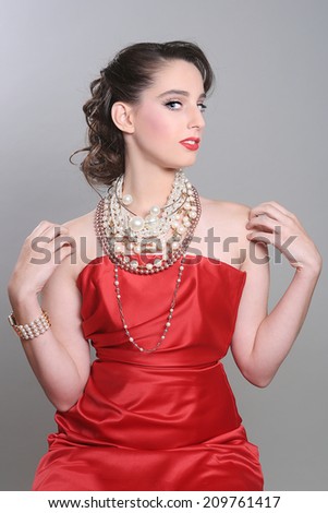 Red Themed Fashion Model Wearing Lots of Pearls