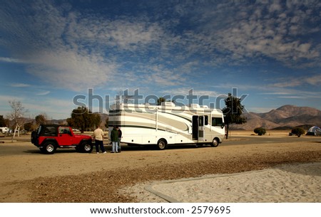 RV Coach Towing an Offroad 4X4 Vehicle