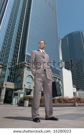 Good Looking Black Business Man Outdoors Next to Skyscrapers