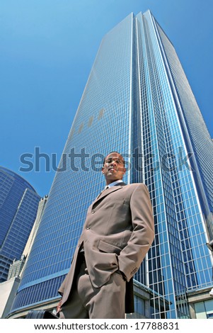 Handsome Black Business Man Outdoors Next to Office Buildings