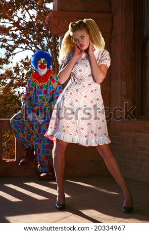 Abstract Image of a Tall Beautiful Woman Being Watched by a Sinister Clown