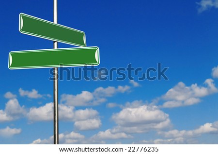 Blank Green Street Name Signs Against a Bright Blue Sky. Insert Your Own Text