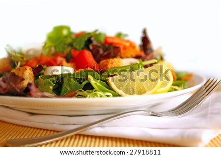 Healthy Salad on a Plate With Focus on Lemon
