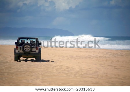 Offroad Vehicle on sand at a Remote Beach in Hawaii