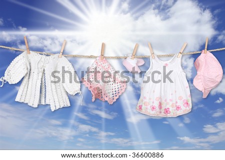 Adorable Baby Girl Clothes Hanging Outdoors