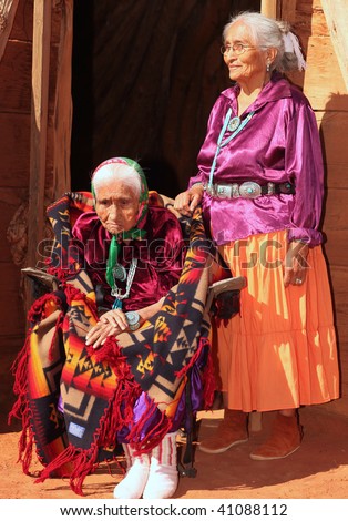 Elderly 99 year OldNavajo Woman and Her Daughter Outside a Traditional Hogan