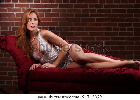 Sensual Red Head Woman Wearing Lingerie in Seductive Poses