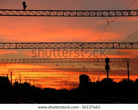 Sunset over urban railway station