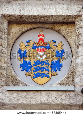 Medieval heraldry on the front wall of city hall