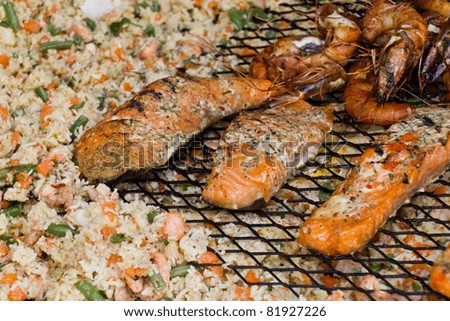 Various seafood, fish, shrimps on the wok pan