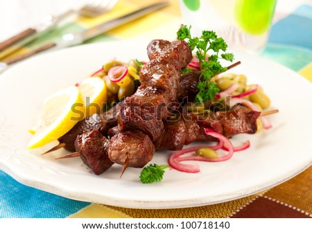 Grilled lamb kebabs with bean salad