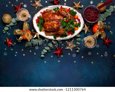Concept of Christmas or New Year dinner with roasted chicken and various vegetables dishes. Top view.