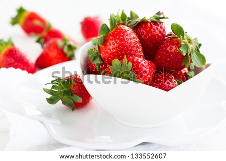 Fresh strawberry in the white bowl Fresh strawberry in the white bowl