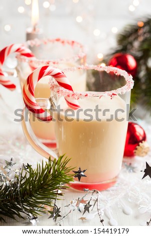 Creamy Peppermint Punch with candy cane