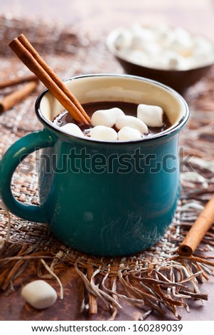 Hot chocolate with  marshmallows and cinnamon stick