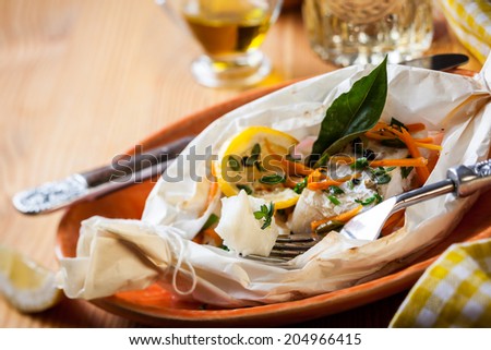 Cod fillets  baked in parchment paper
